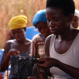 female weaving a Pala case