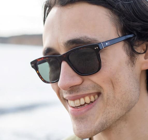 Man wearing square brown sustainable sunglasses