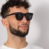 man wearing black square eco-friendly sunglasses