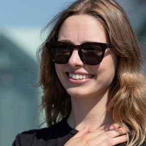woman wearing square brown sustainable sunglasses