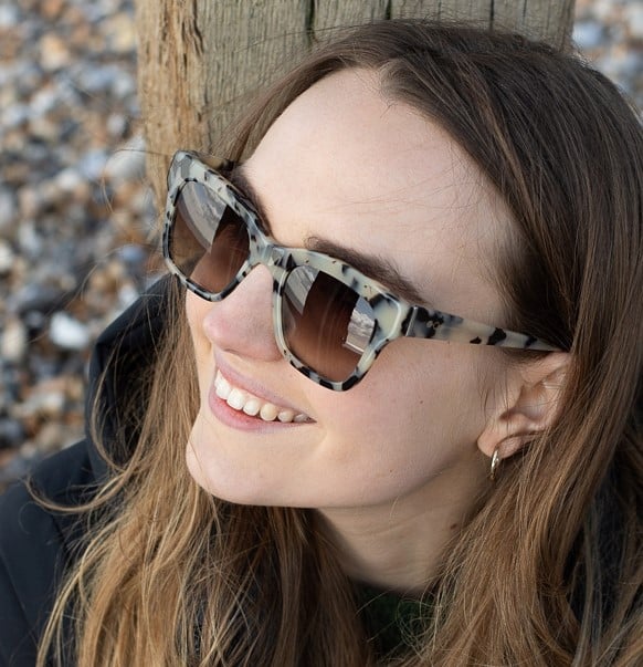 woman wearing grey cateye sunglasses