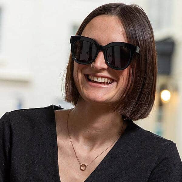 woman wearing sustainable black oversize cat-eye sunglasses