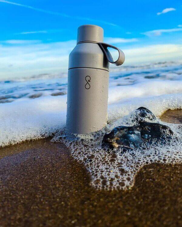 Reuseable water bottle at the beach