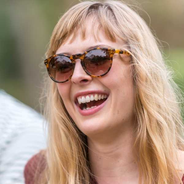 woman wearing tortoiseshell round eco friendly sunglasses