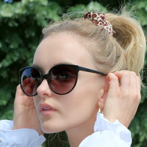 woman wearing oversized round eco friendly sunglasses in black