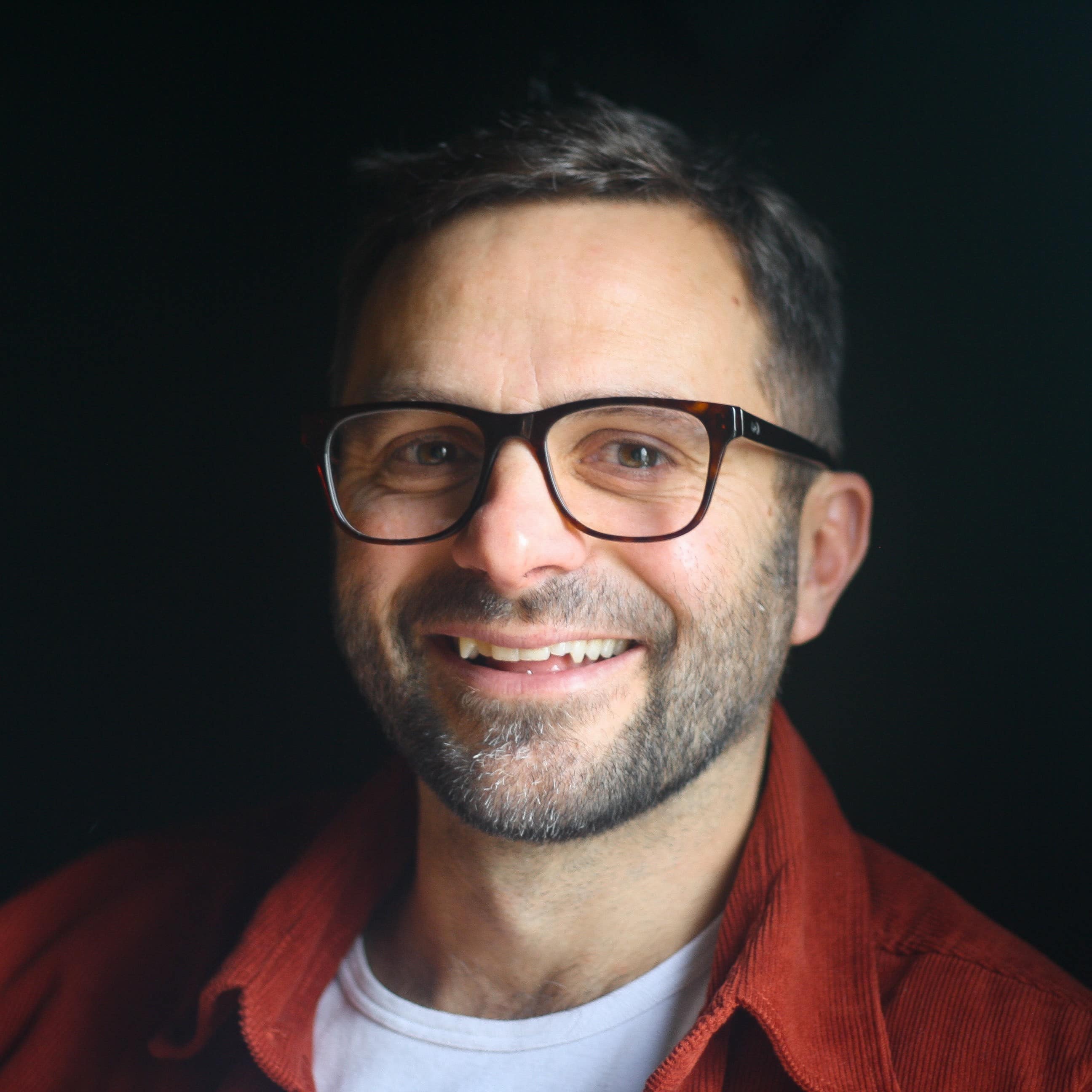 Man wearing bio-acetate square glasses in havana brown tortoiseshell.